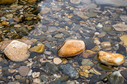 Granite stones under water background. High quality photo