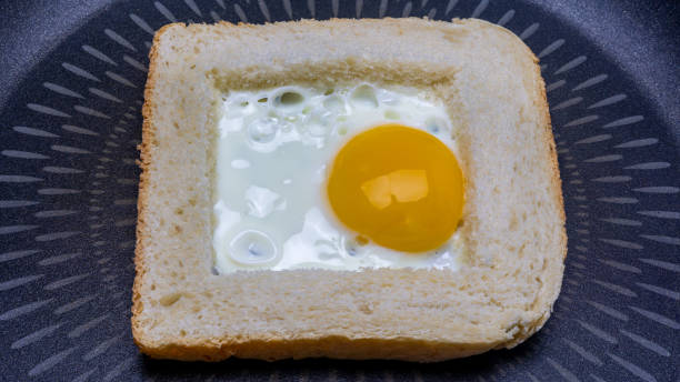 istock closeup of Freshly cooked fried egg inside a bread 1904998347