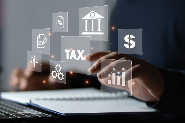 istock Busines using a computer to complete Individual income tax return form online for tax payment. 1904999962