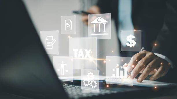 istock Busines using a computer to complete Individual income tax return form online for tax payment. 1904999968