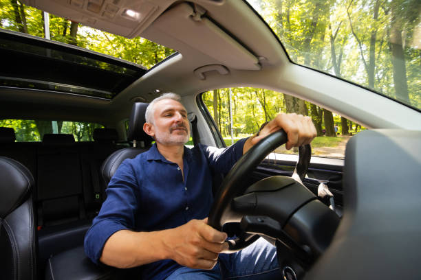 istock Great selfie. Handsome mid age bearded man while sitting in the car at the driver seat 1905011341