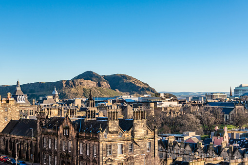 View over Edinburgh to Holyrood Park hill, clear sky copy space