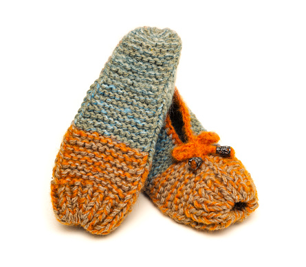 Handmade colorful  made in wool slippers on a white background