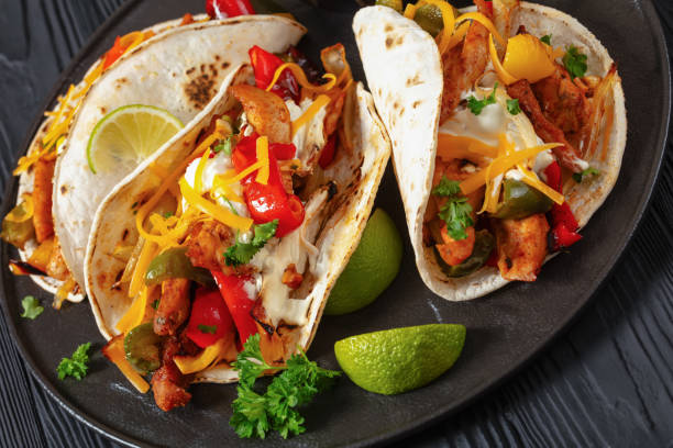 istock baked tex-mex chicken fajitas on a plate, top view 1905122090