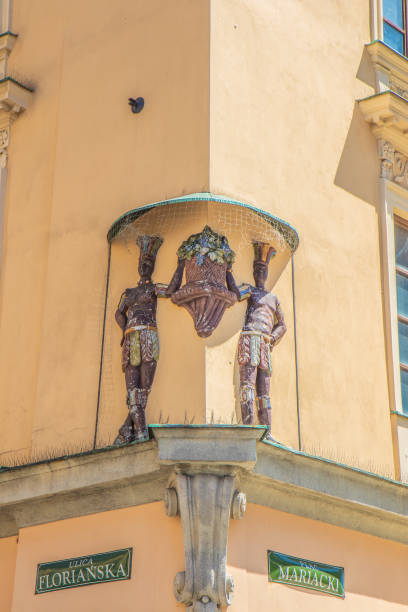 istock Relief depicting niggers on building 1905127687