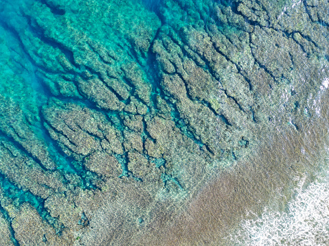 coral reefs and crystal clear water from above. drone point of view at okinawa islands, japan.