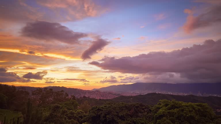 Aerial panning view of Caracas city valley with El Avila Mountain at the background during the sunset