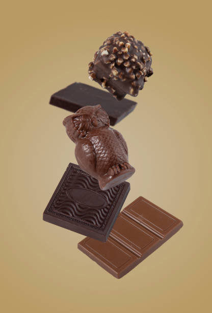 istock chocolate candies flying on a yellow background 1905146635