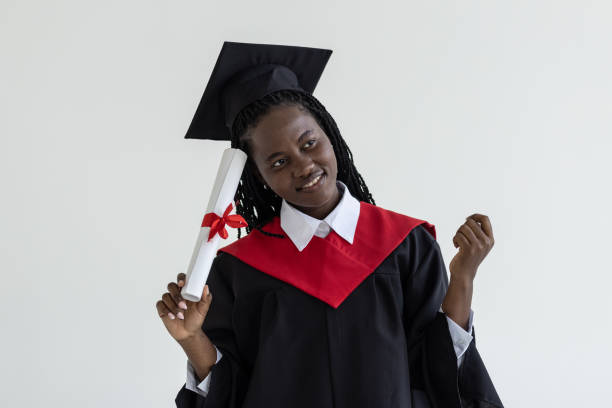 istock Young african american graduate student with diploma in her hand 1905151413