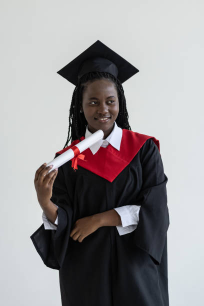 istock Young african american graduate student with diploma in her hand 1905157111