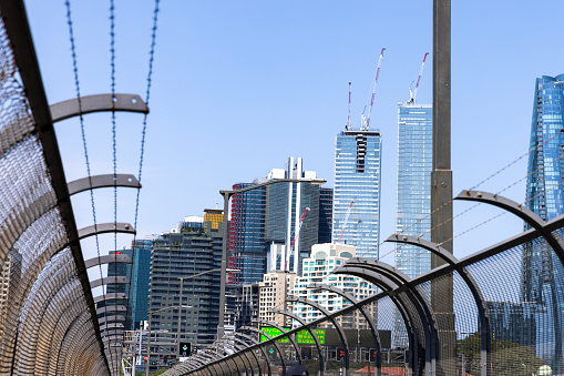 High section of pedestrian walkaway on Sydney Harbour Bridge with city skyline, background with copy space, full frame horizontal composition
