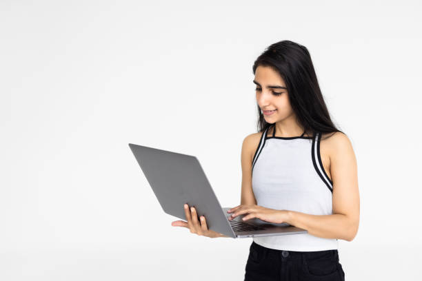istock Indian woman or employee using laptop on white background. 1905170094