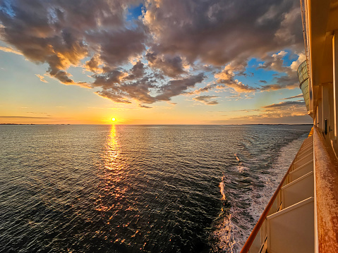 Sunset from the deck of an cruise ship in open sea