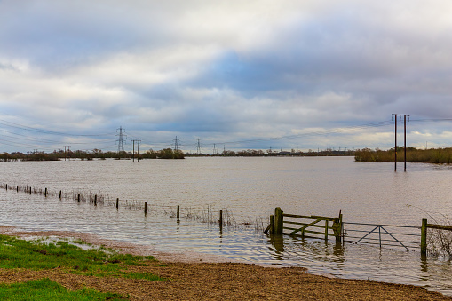 Storm Henk, the River Aire bursts its banks and floods the agricultural fields around the villages of Birkin and West Haddlesey near Selby, North Yorkshire in December 2023.  Horizontal.  Copyspace