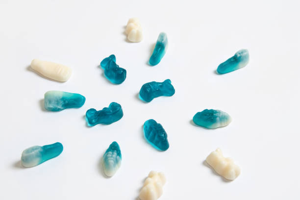 istock Blue and white gummy candies on white background 1905305519