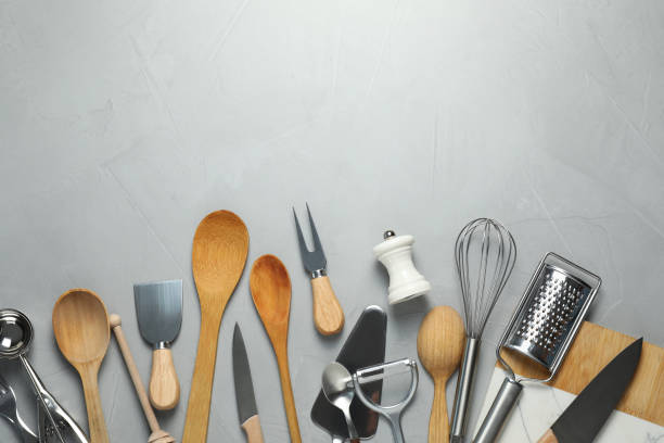 istock Set of kitchen utensils on light grey table, flat lay. Space for text 1905409318