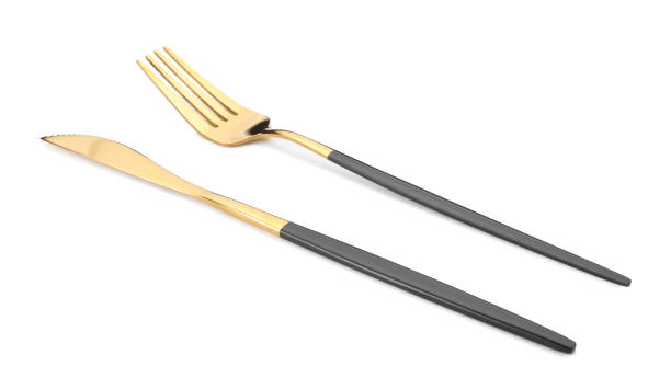 istock Shiny golden fork and knife isolated on white. Luxury cutlery 1905412980