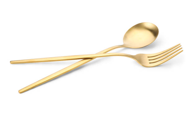 istock Shiny golden fork and spoon isolated on white. Luxury cutlery 1905414527