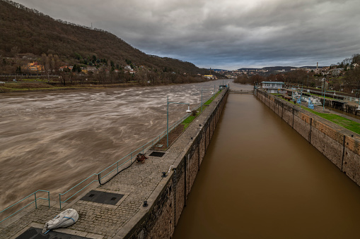 Flooded winter without snow river Labe with cloudy sky in Usti nad Labem CZ 12 25 2023
