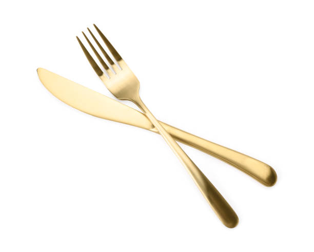 istock Shiny golden fork and knife isolated on white. Luxury cutlery 1905489815