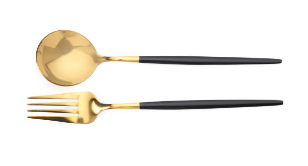 istock Shiny silver fork and spoon isolated on white, top view. Luxury cutlery 1905491387