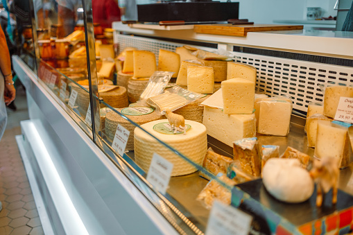 Large selection of cheeses on typical italian farmer market