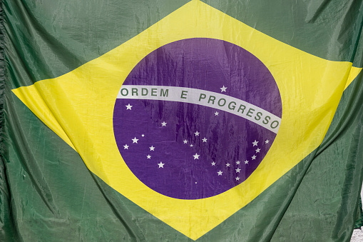 Brazilian flag. In the center of the flag with the words order and progress in Portuguese.