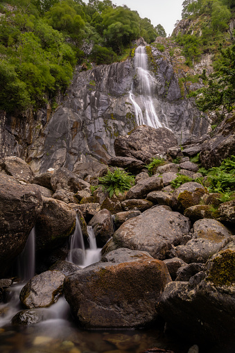 Tall waterfall cascading over igneous rock - Aber Falls (Rhaeadr Fawr) North Wales