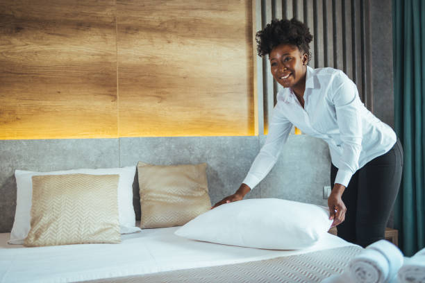 istock Maid working making the bed at a hotel. 1905615428