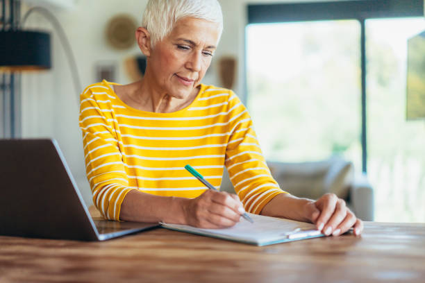 istock Senior woman at Home office 1905619550