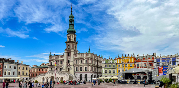 Zamosc, Poland, September 3, 2023: The market square in Zamosc and historic, colorful tenement houses around the market square.