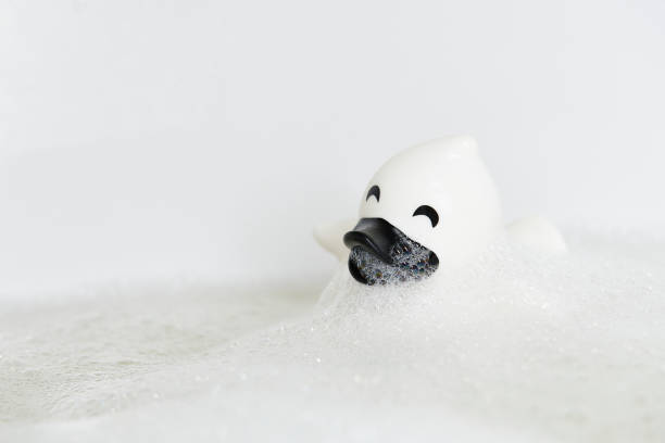 istock Rubber duck in a bathtub with foam close-up 1905634527