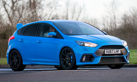 Stony Stratford,UK Jan 1st 2024.  2017 blue Ford Focus RS  car arriving at Stony Stratford for the annual New Years Day vintage and classic vehicle festival.