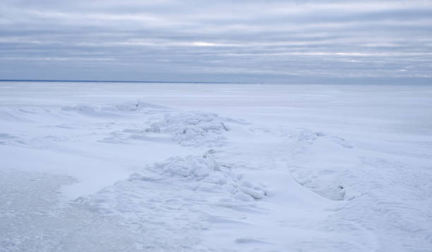 istock A snow covered frozen sea with a cloudy sky 1905642201
