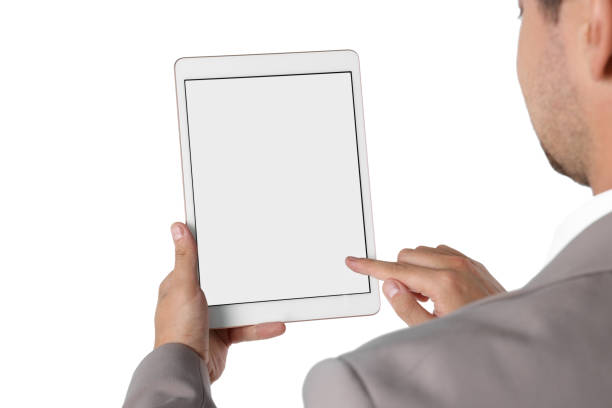 istock Man using tablet with blank screen on white background, closeup. Mockup for design 1905656139