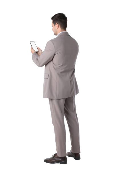 istock Man holding smartphone with blank screen on white background 1905656142