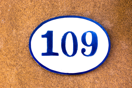 Ceramic Number 109 Street Address Tile; Brown Stucco. Shot in Santa Fe, NM.