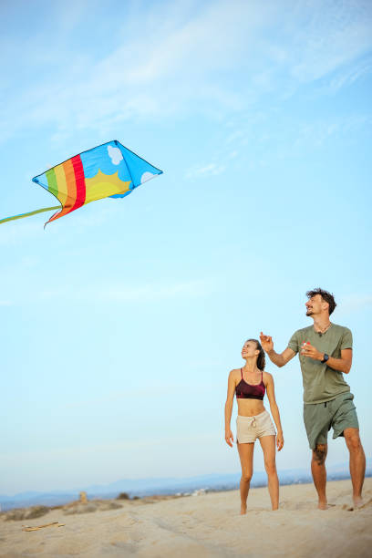 istock Playing with kite on beach near sea 1905666628