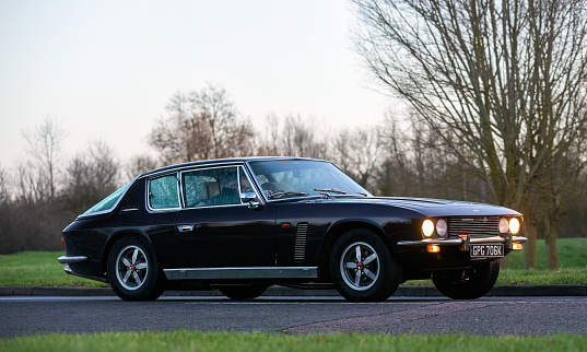 Stony Stratford,UK Jan 1st 2024. 1971 Jensen Interceptor  car arriving at Stony Stratford for the annual New Years Day vintage and classic vehicle festival.