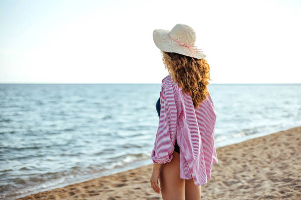 istock Woman enjoys the beach 1905776837