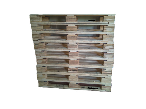 Used wooden pallets are stacked on top of each other on a white background.