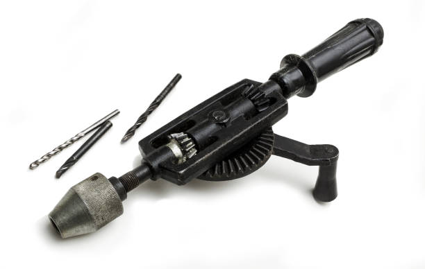 istock Grandfathers old hand-cranked drill on a white background 1905848481