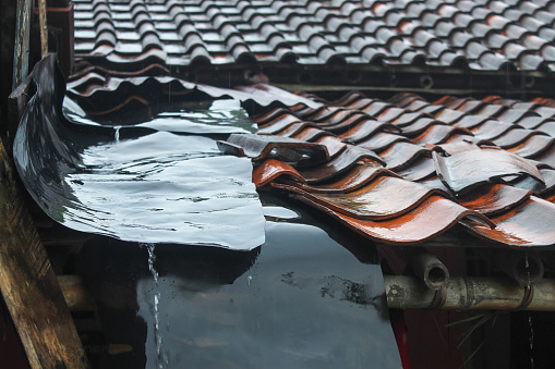 the roof of the house was wet from the rain. Rooftile