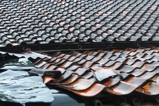 the roof of the house was wet from the rain. Rooftile