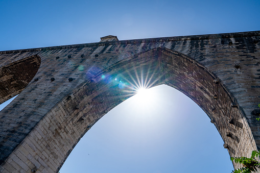 Close up view on a fragment of the triumphal arch isolated on a white background (copy space)