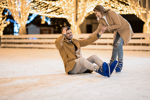 Romantic winter scene, happy young couple having fun on fresh show on winter vacatio, mountain nature landscape
