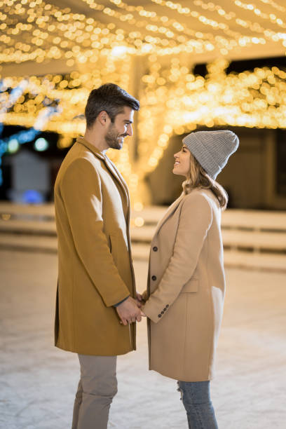 istock Happy couple ice skating on a holiday. 1905932266