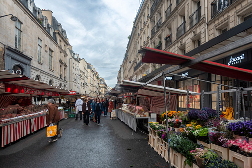 Street market in Paris, France near the Champs Elysee under cloudy skies