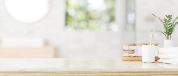 istock Luxury bathroom tabletop with toiletries set and copy space in a modern white bathroom. 1905977115