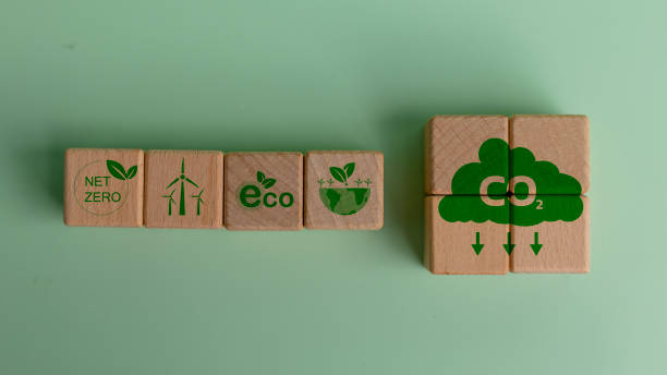 istock Reduce CO2 emission. Carbon neutral and net zero concept natural environment Climate neutral long term strategy greenhouse gas emissions target. Wooden block green net zero icon. 1905982310